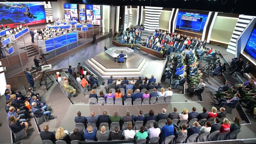 Russian President Vladimir Putin answers questions from a studio audience and citizens calling in, at his annual Direct Line session on Thursday.