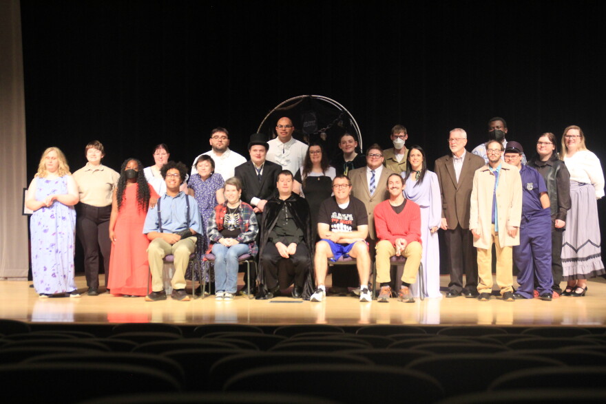 A cast of characters appearing in a theater production.
