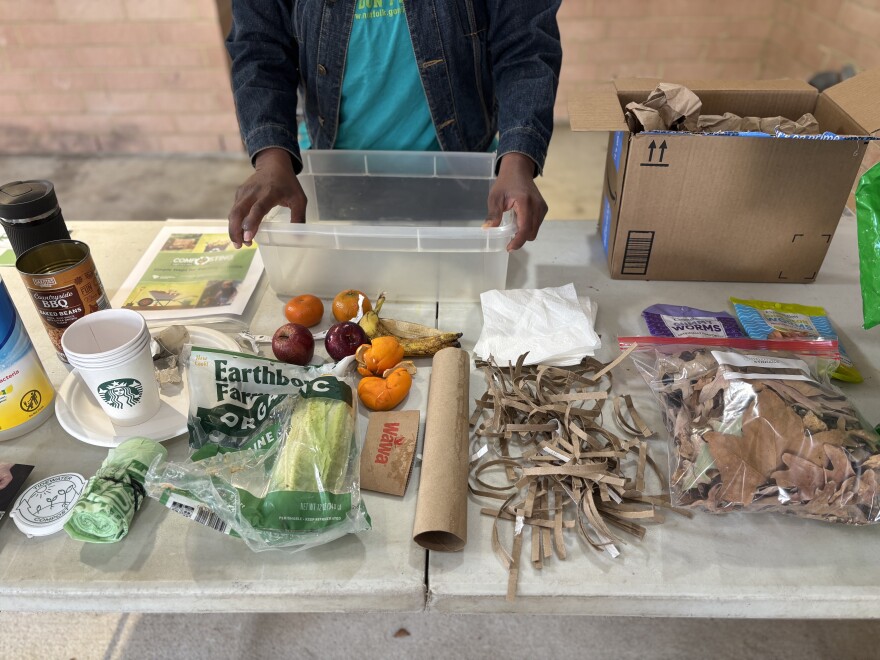 A table displaying compostable materials, such as cardboard and food waste, at the UpCycle Festival in Norfolk on Saturday, Nov. 15, 2025.