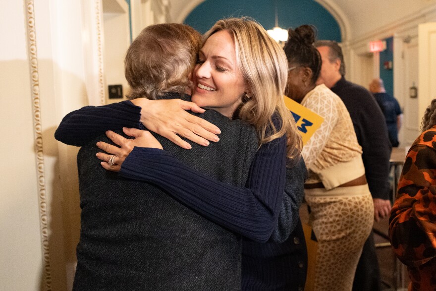 Scranton Mayor Paige Cognetti hugs campaign volunteer Patrick Joyce as the mayor celebrates her re-election at Bukatini at Posh in Scranton on Tuesday, Nov. 4, 2025. (Christopher Dolan / WVIA News)