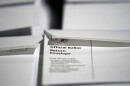 In this Thursday, Sept. 3, 2020, file photo, stacks of ballot envelopes waiting to be mailed are seen at the Wake County Board of Elections in Raleigh, N.C.