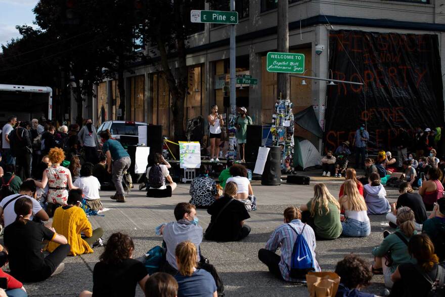 Protesters have gathered at the CHAZ to listen to speeches and watch documentary films.