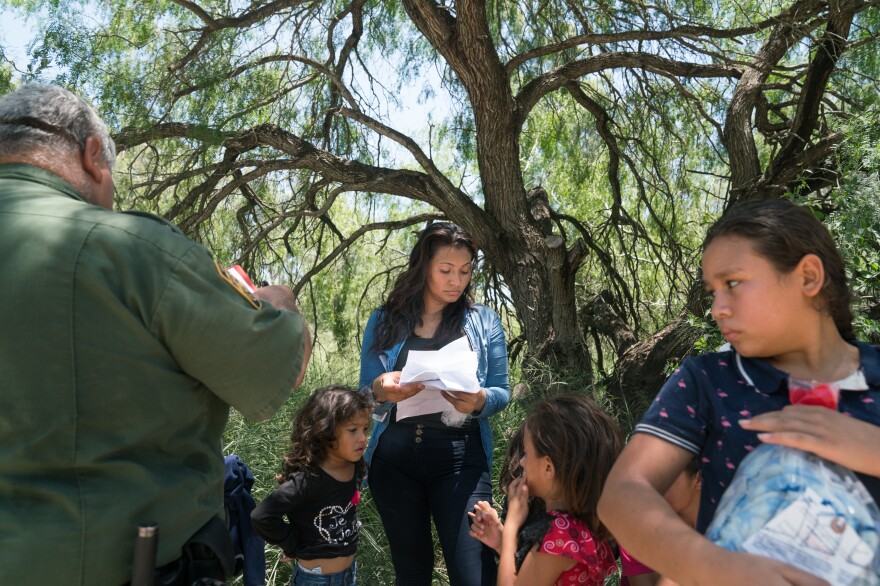 Dahani Gudiel, 25, from Guatemala turned herself and her three daughters in to the U.S. Customs and Border Protection outside of McAllen, Texas on Monday. Gudiel says she crossed the border seeking asylum after being threatened by gangs at home.
