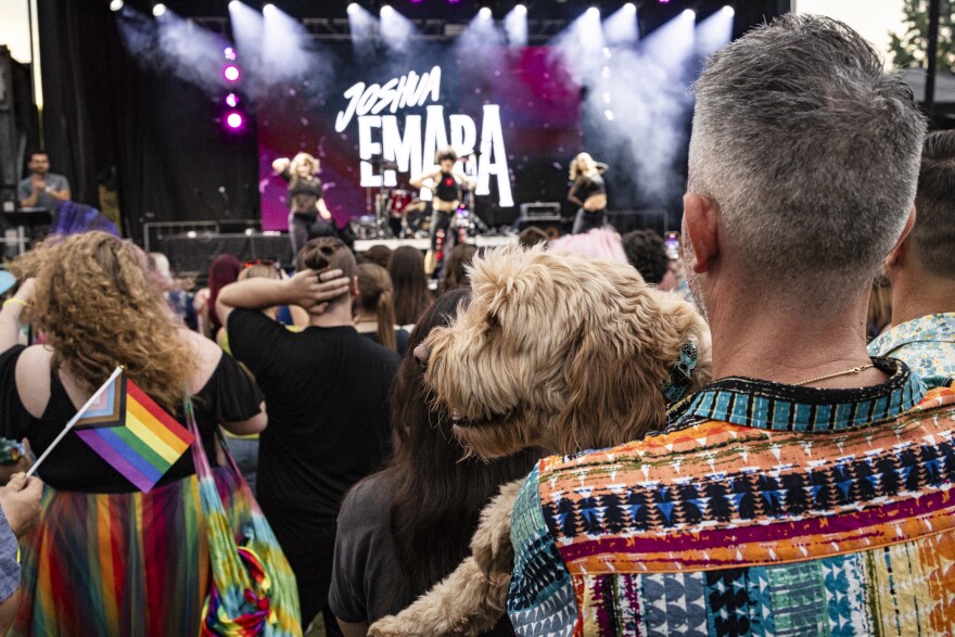 A picture of a performance by Joshua Emara, from the perspective of the crowd