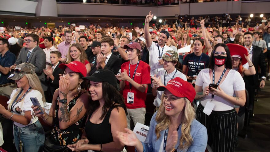 Students cheer as Trump speaks.