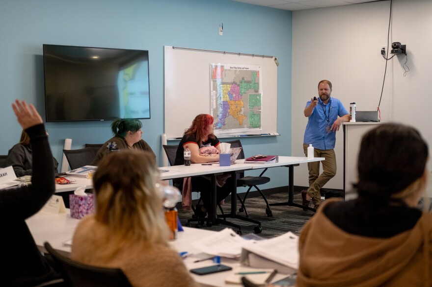 Instructor John Shryock conducts a training session at Denver 911.