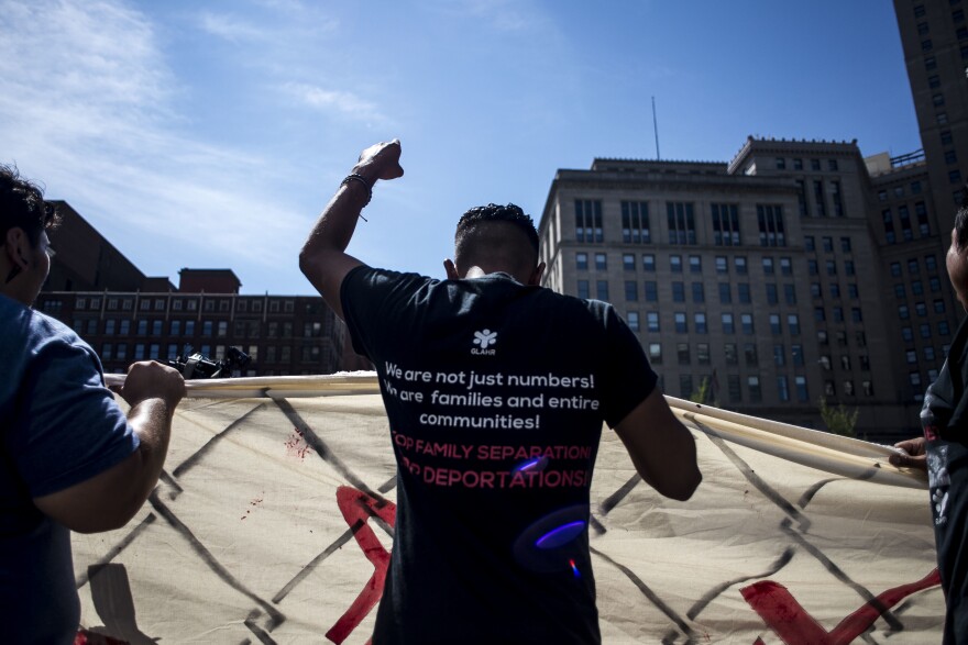 Organizers from Mijente, Georgia Latino Alliance for Human Rights, Ruckus Society and other activist organizations stage a protest and march outside Quicken Loans Arena in Cleveland during the Republican National Convention in July 2016.