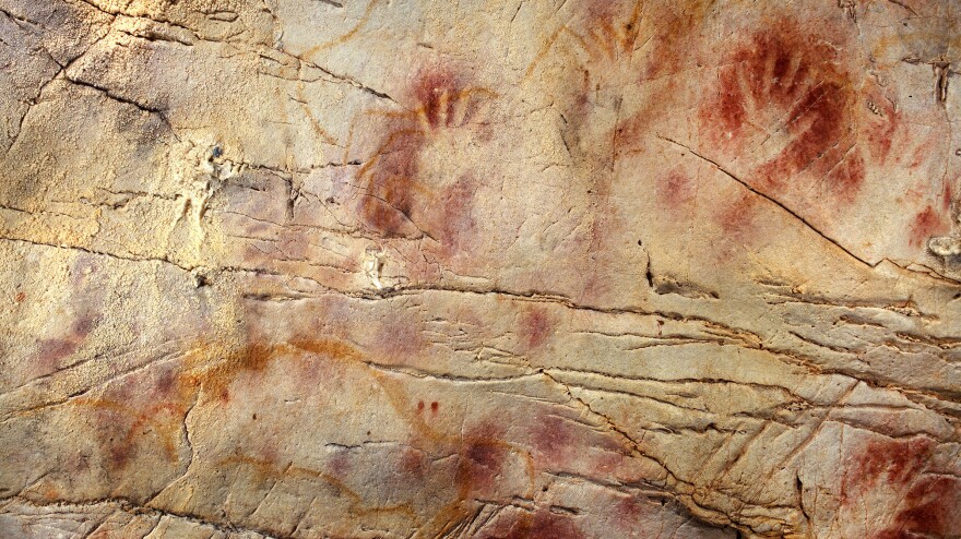 The Panel of Hands in the Cave of El Castillo in Spain. New dating methods suggest the paintings could have been drawn by Neanderthals, not humans, as previously thought.