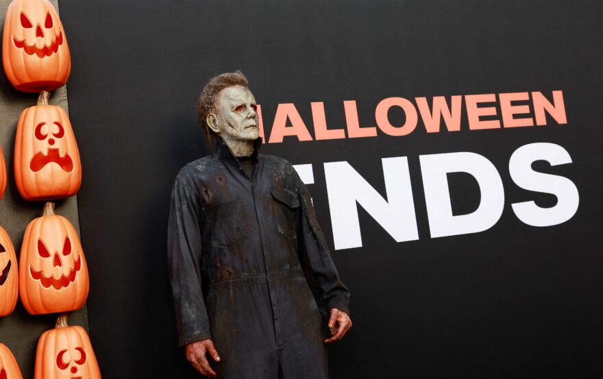 A person dressed as the character Michael Myers arrives for the premiere of "Halloween Ends" at the TCL Chinese Theatre in Hollywood, California.