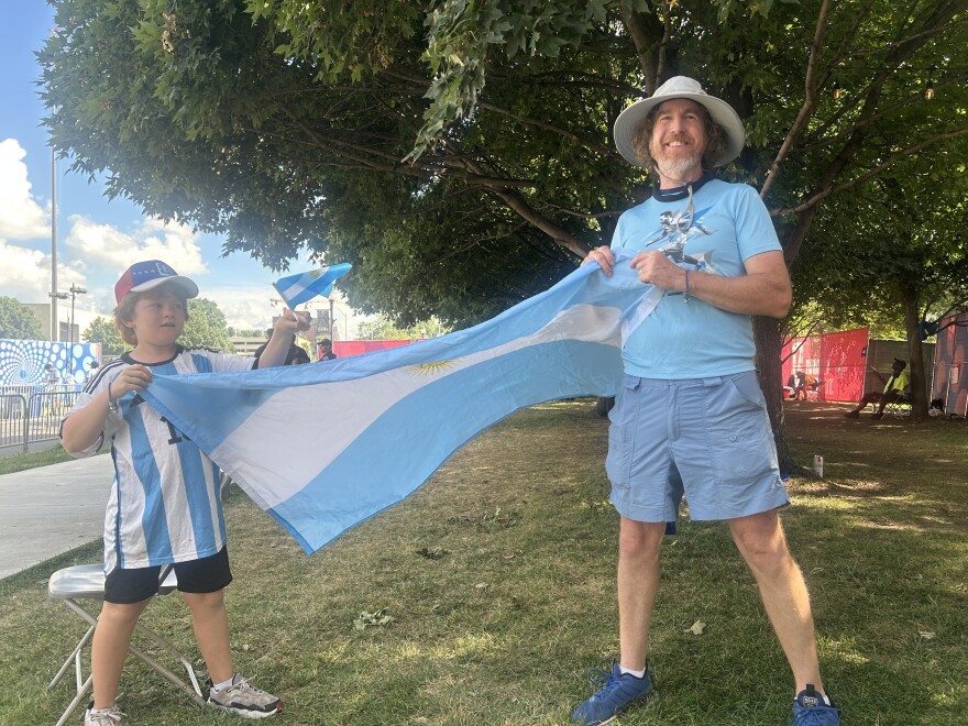Marcus Bowman and his son stop by Kansas City's Fan Fest to cheer on Argentina.