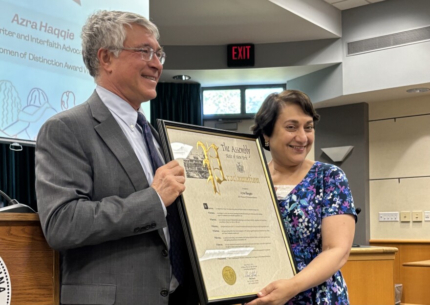 Azra Haqqie receiving a Woman of Distinction Award in 2024 for her work