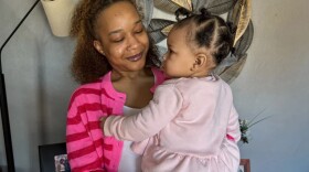 Matte’a Brooks takes care of her daughter inside their home in southern Illinois. Brooks signed up for Medicaid after finding out that her daughter was on the way.