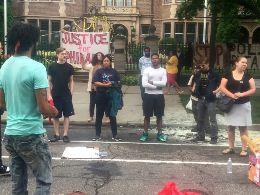 About 200 people gathered outside the Minnesota Governor's Residence in St. Paul, Thursday, July 7, 2016, protesting the fatal shooting of a man by a suburban police officer. Philando Castile was shot in a car Wednesday night in the largely middle-class St. Paul suburb of Falcon Heights. (Jeff Baenen/AP)