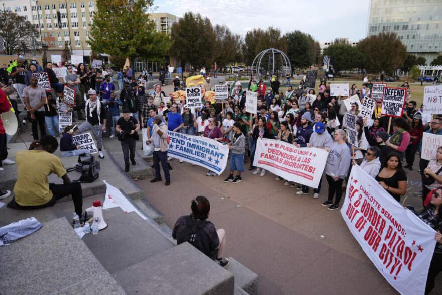 People protest against federal immigration enforcement Saturday, Nov. 15, 2025, in Charlotte, N.C. (Erik Verduzco/AP)