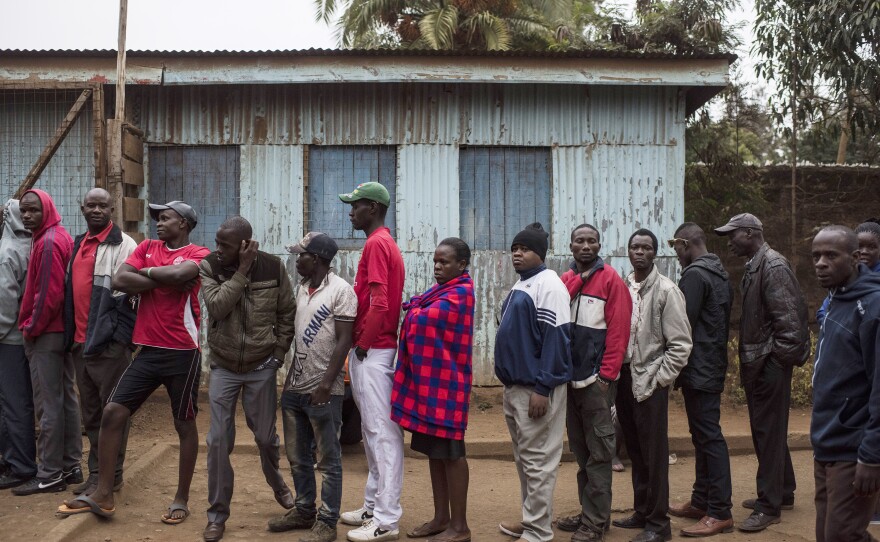 People gather to vote at Olympic Primary School in the Kibera neighborhood of Nairobi, Kenya on Tuesday.