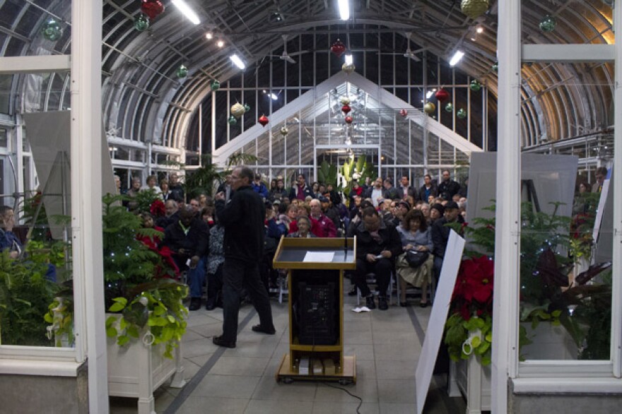 A representative for Pedestal Oil Company explains the Lake Hefner drilling proposal to a crowd gathered in the Ed Lycan Conservatory at Will Rogers Gardens.