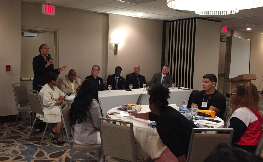 Cleveland Police Sgt. Charmin Leon (standing) says her department is working to recruit people more skilled in conflict resolution, a skill that's needed in the city since only about 7 percent of their calls end in an arrest.