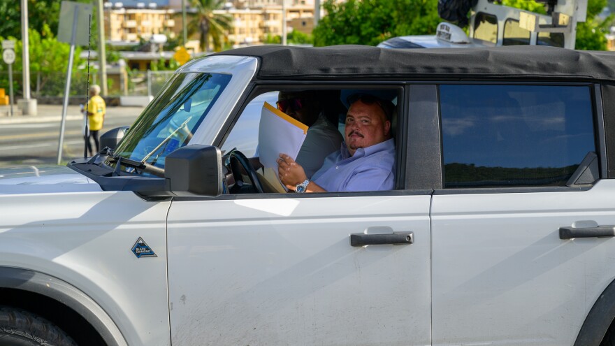 Brett “Mac” McClafferty drives away from the Elections System of the Virgin Islands on St. Thomas on May 19.