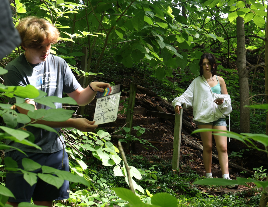 Grahm Irish of Davenport (left) works on location in Rock Island this month with Faye Knightly, who plays Nyah in the Fresh Films series "Dearly Departed."