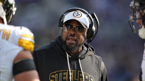 Pittsburgh Steelers head coach Mike Tomlin talks to players on the sideline during the first half of an NFL football game against the Baltimore Ravens, Sunday, Dec. 7, 2025, in Baltimore. 
