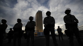 Police stand guard as protesters rally at the Trump Tower, Monday, June 1, 2020, in Las Vegas, over the death of George Floyd. (John Locher/AP)