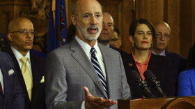 Gov. Tom Wolf speaks at a news conference in his Capitol offices as he unveils a $1.1 billion package intended to help eliminate lead and asbestos contamination in Pennsylvania's schools, homes, day care facilities and public water systems, Wednesday, Jan. 29, 2020 in Harrisburg, Pa. Looking on are Democratic state lawmakers and officials from teachers' unions. (AP Photo/Marc Levy)