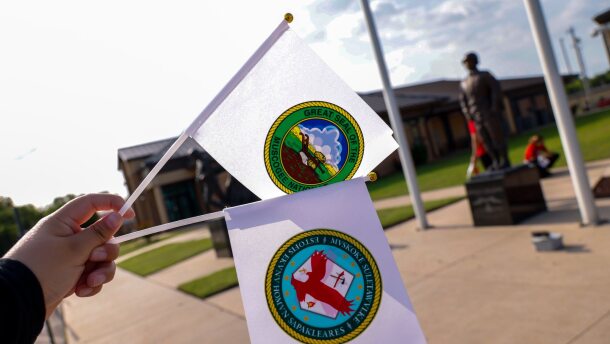 Muscogee Nation flags are seen.