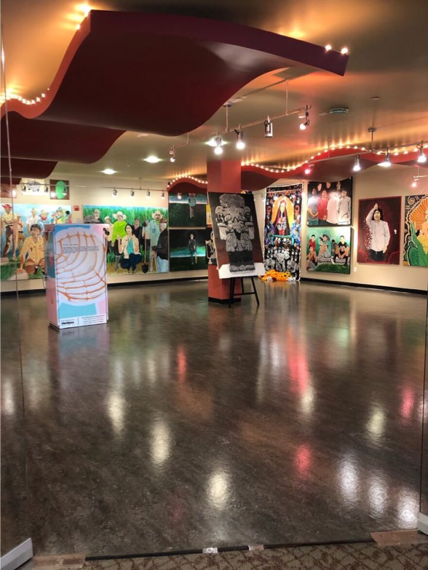 Paintings by Chicano artist Eddie Melendrez exhibited in a gallery at the Hispanic Cultural Center of Idaho