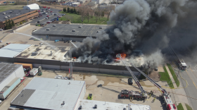 Overhead color camera view of a fire from a drone