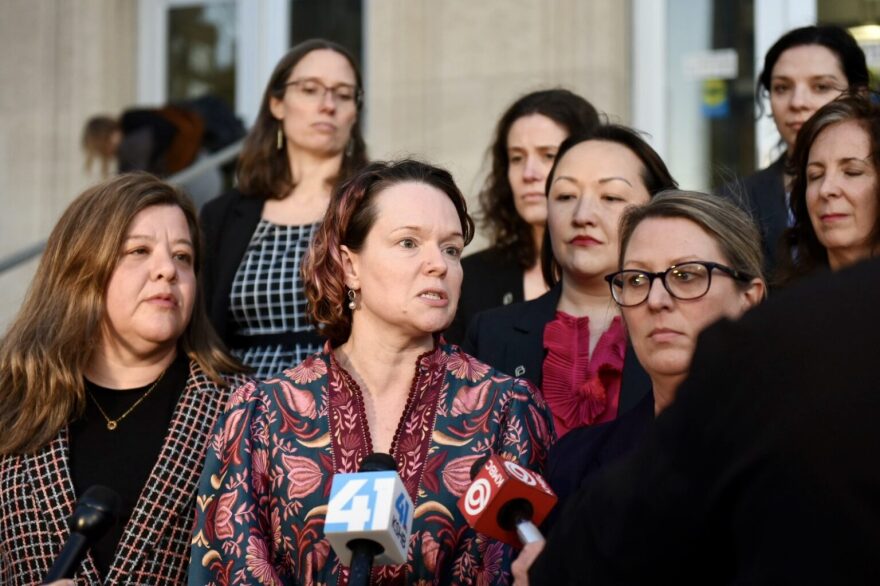 Dr. Margaret Baum (center), chief medical officer with Planned Parenthood Great Rivers, speaks to reporters following the opening day of a trial litigating Missouri’s abortion regulations on Monday, Jan. 12, 2025, in front of the Jackson County courthouse in Kansas City (Anna Spoerre/Missouri Independent).