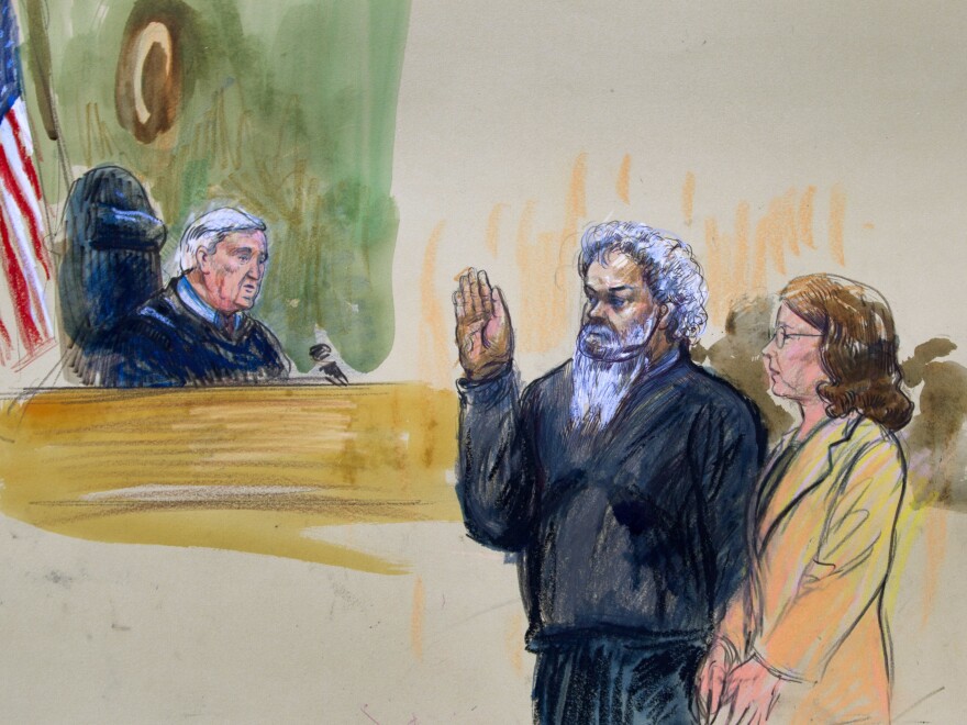 Ahmed Abu Khatallah, seen here in a 2014 artist's rendering, faces his judge during a hearing at the federal District Court in Washington, D.C.