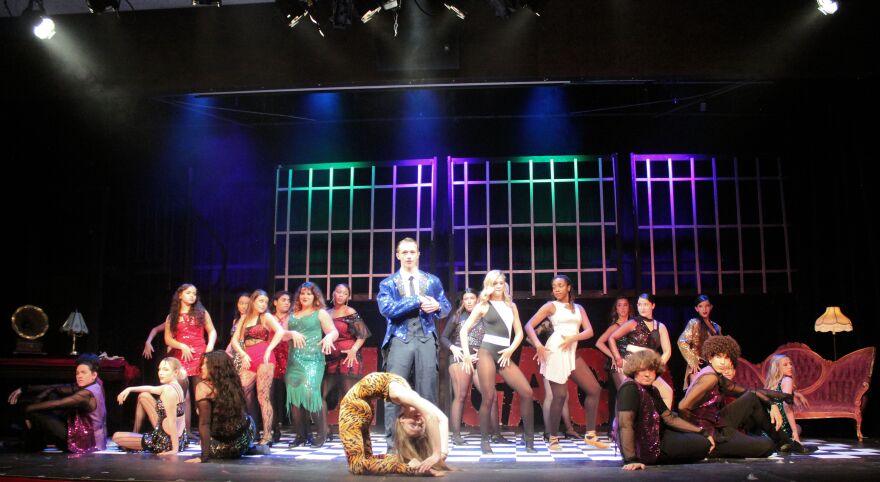 Connor Jackson, as the big bamboozler, Billy Flynn, razzle dazzles the audience in 'Chicago.' 