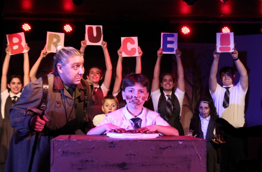 Allison Lund as Headmistress Trunchbull and Frankie Savage as Bruce in chocolate cake scene from 'Matilda."