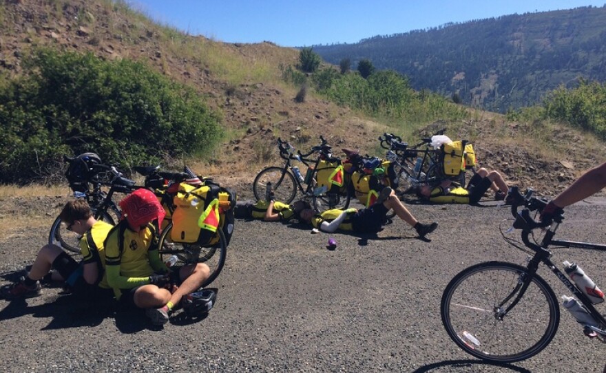 An image of bikers resting alongside the road