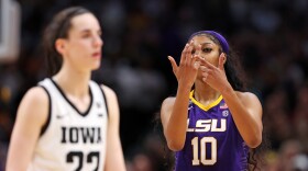 Angel Reese of the LSU Tigers gestures towards Caitlin Clark of the Iowa Hawkeyes towards the end of the NCAA Women's Basketball Tournament championship game in Dallas on Sunday.