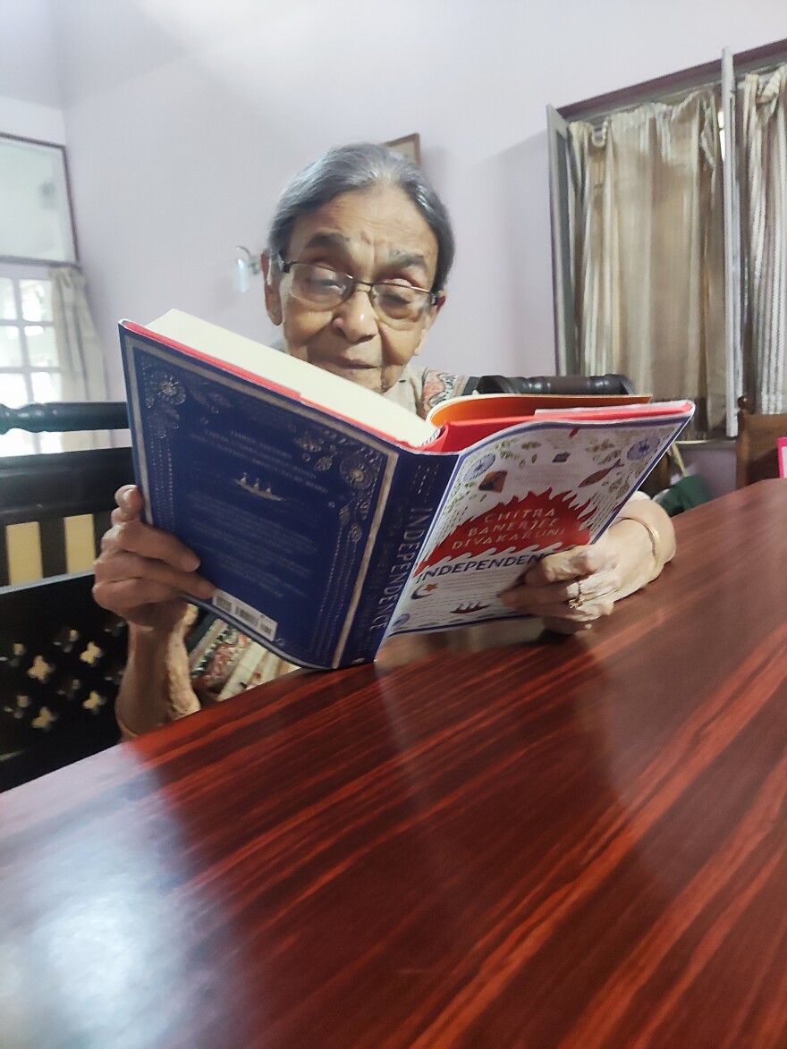 Sandip's mother Reba Roy who saw India become independent reads Chitra Banerjee Divakaruni's novel Independence set in those years.