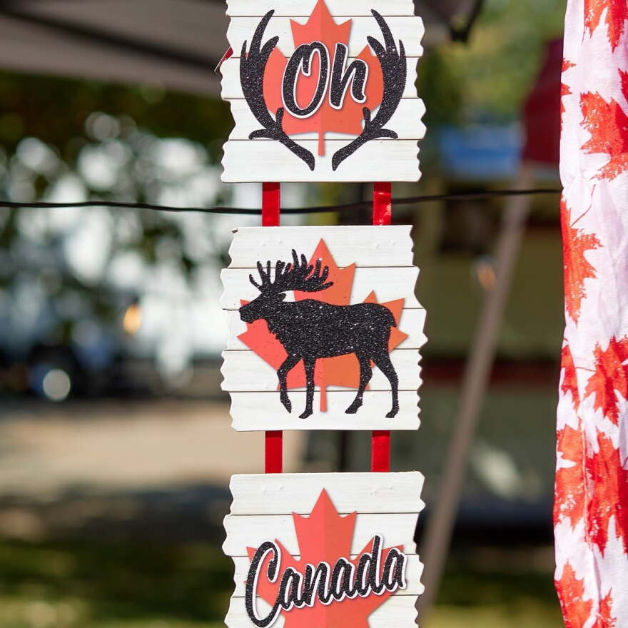 Signage at the 2025 Canadiana Festival depicting a moose and the phrase "Oh, Canada"