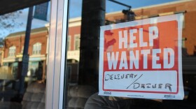 A help wanted sign in the window of Gary's Furniture and Appliance in downtown Presque Isle.