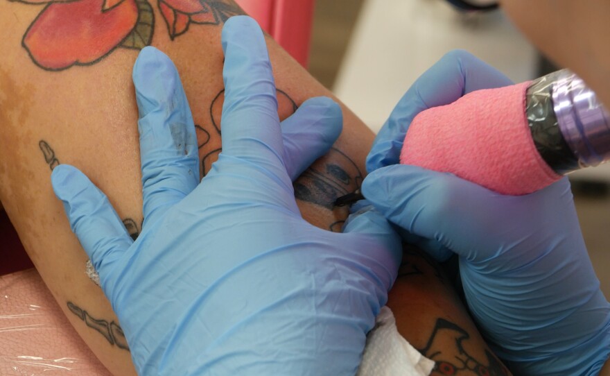 Cheyenne Rollerson had been carrying her dog’s ashes for 6 years. And for one young mother…the answer was a place where she'd never have to let go. Izzy was a Boston terrier who passed away after being bitten by a rattle snake while protecting the families two young siblings who were also playing outside at the time. Rollerson honored her beloved pet by mixing a small amount into tattoo in and then added into a tattoo at artistic soul tattoo in Chiefland. What people decide about their end of life arrangements can say *everything* about how they lived. We met with three families who chose a *different* kind of goodbye. One by land, one by water and another just under the skin.