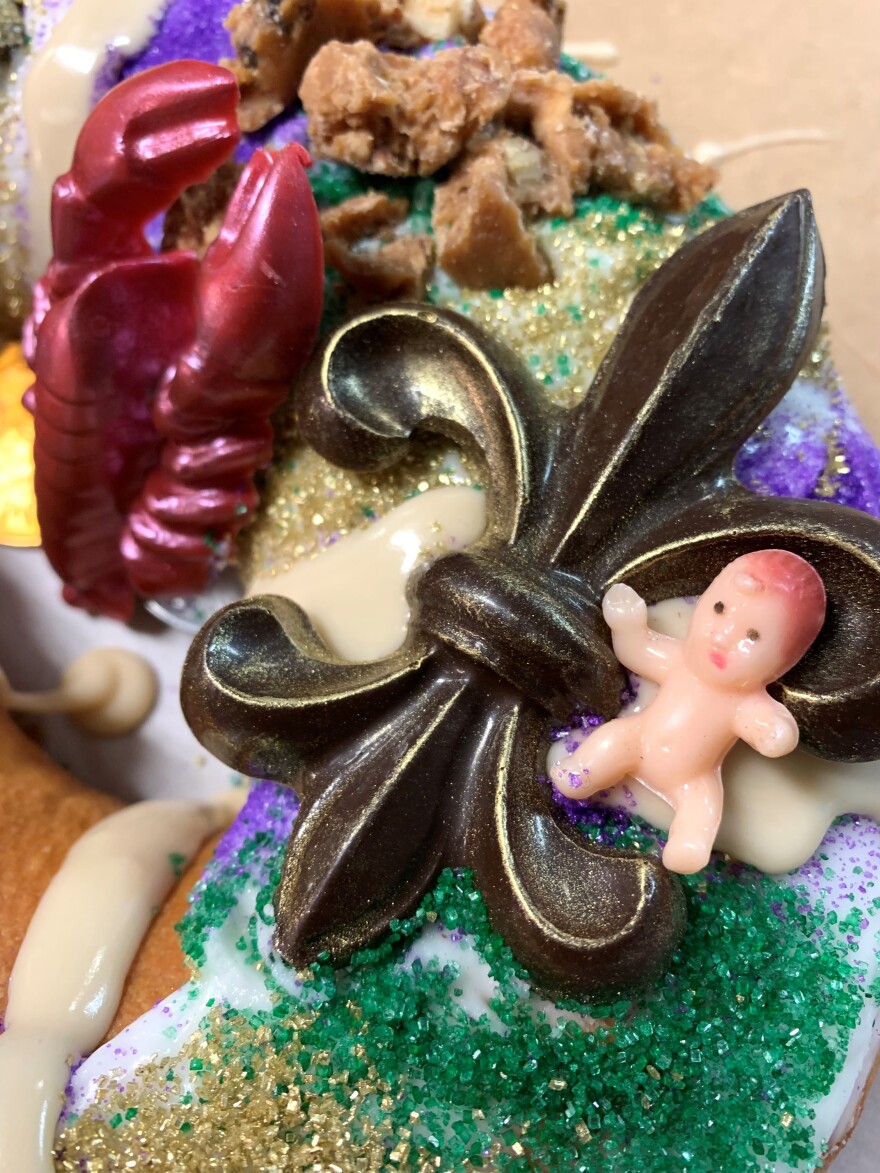 Simone Faure, owner/chef of La Pâtisserie Chouquette, makes the fleur de lis from chocolate. The tiny baby is not edible, unfortunately.