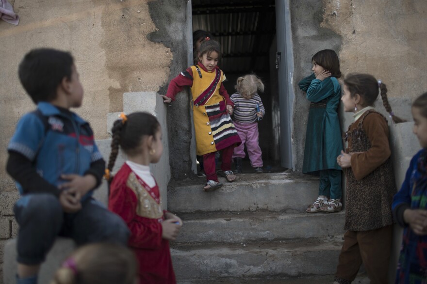 Iraqi children play at the Hassan Sham camp on Nov. 9.