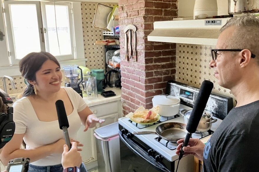 Karla Tatiana Vasquez (left), interviewed by <em>Morning Edition</em> host A Martinez in Los Angeles.