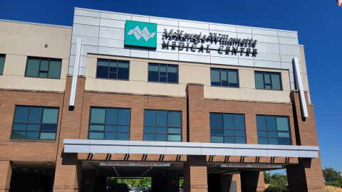 A hospital building. A sign says "McKenzie-Willamette Medical Center."