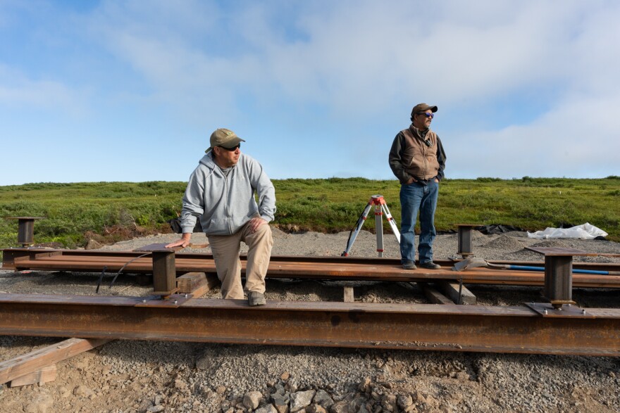 Engineer Patrick M. LeMay, PE and Newtok Relocation Coordinator Romy Cadiente stand on the foundation of a future home in Mertarvik, Alaska on July 12, 2020.