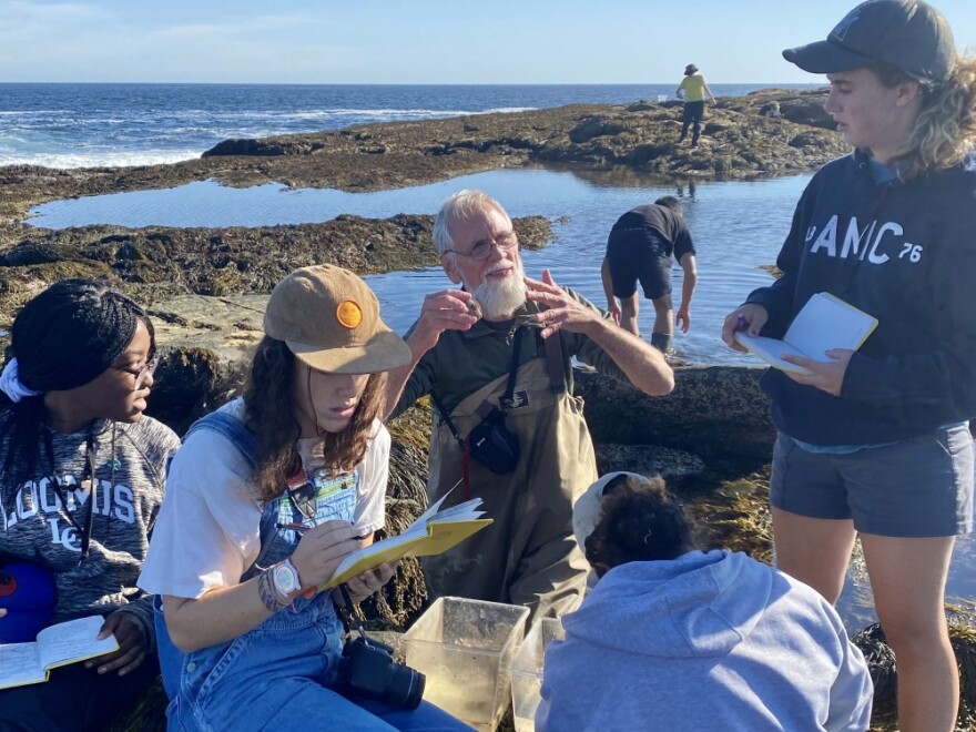 Reseacher Jeff Goddard with some students.