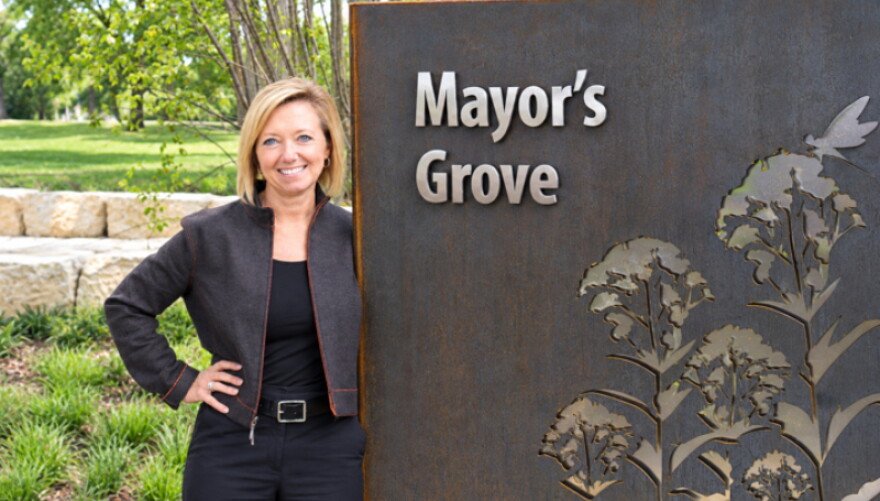 Rosalynn Bliss at the sign for Mayor's Grove Grand Rapids