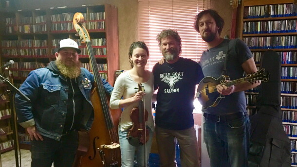 Jim Belcher, flanked by member of the Stillhouse Junkies, following an in-studio performance at KSUT.