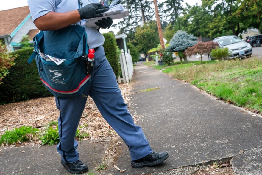 Letter Carrier Connie Cruz delivers mail in Salem, Oregon. 