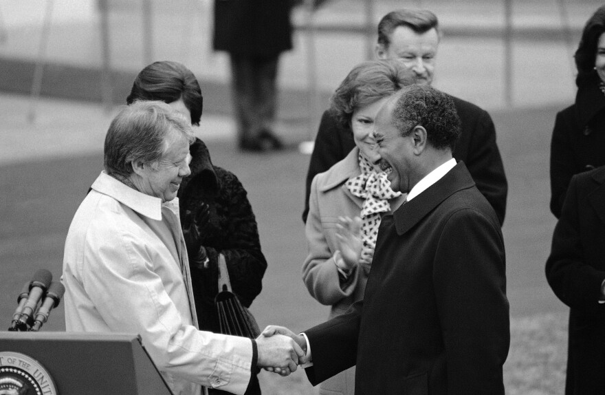 President Jimmy Carter and Egyptian President Anwar Sadat shake hands following Sadat's arrival on the South Lawn of the White House in Washington on Feb. 3, 1978. The two leaders met for talks at Camp David, Md., in the western Maryland Mountains.