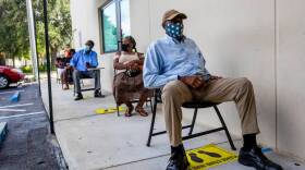 Perejona Lavenal waits for assistance with unemployment at Sant La Haitian Neighborhood Center in North Miami on Aug. 11, 2020. Deloitte Consulting’s work on the state’s unemployment system left millions of Floridians unable to collect unemployment claims. 